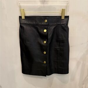 Black leather mini with gold buttons